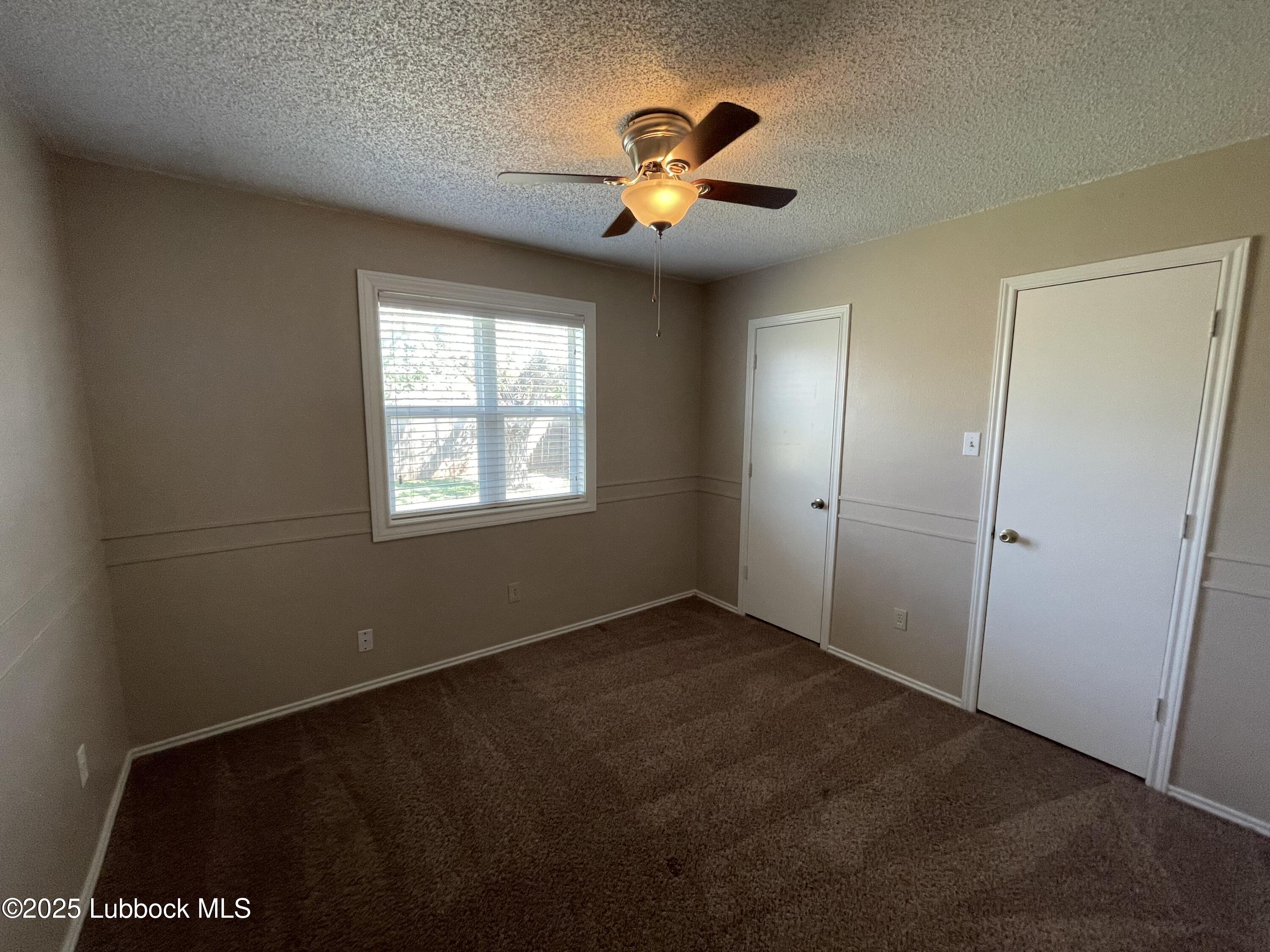6619 Huron Avenue Lubbock, TX 79424 - Photo 5 of 10 a view of an empty room and window