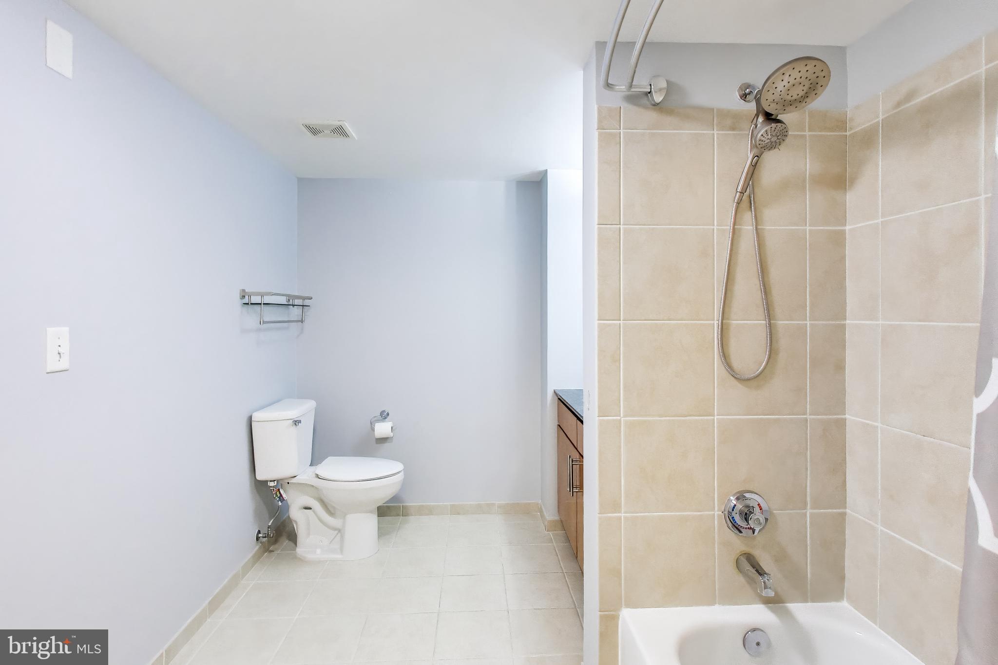915 E Street Northwest, Unit 414 Washington, DC 20004 - Photo 18 of 35 a bathroom with a toilet and a shower