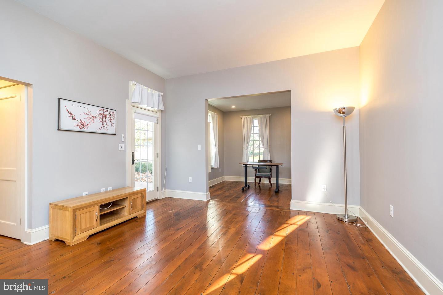 4936 Curly Hill Road Doylestown, PA 18902 - Photo 43 of 102 a living room with furniture and wooden floor