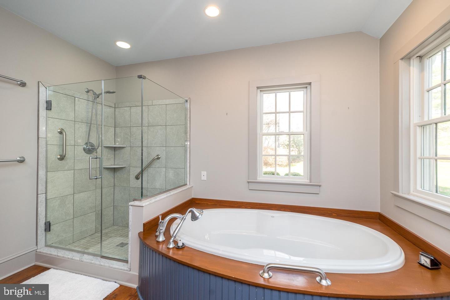 4936 Curly Hill Road Doylestown, PA 18902 - Photo 44 of 102 a bath tub sitting in a bathroom next to a window