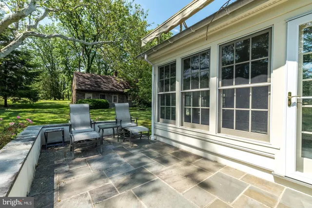 a view of a bathroom with a tub and a window