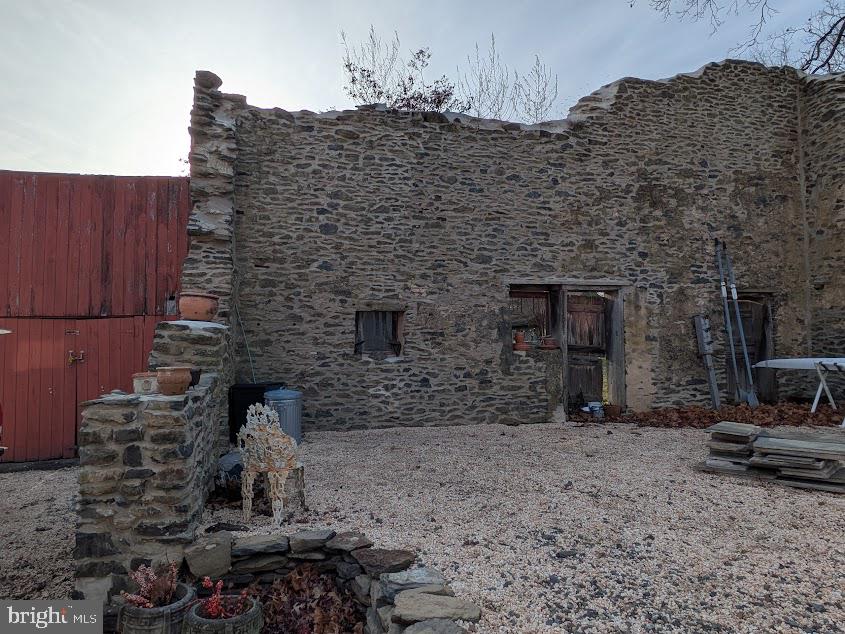 4936 Curly Hill Road Doylestown, PA 18902 - Photo 80 of 102 a brick building with glass door