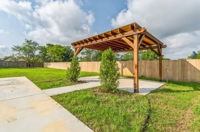 a backyard of a house with a garden and deck