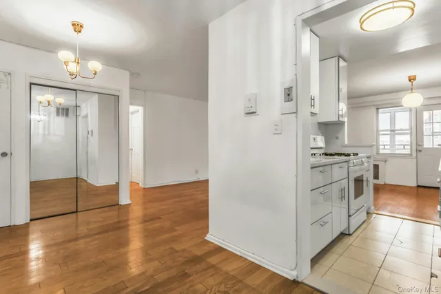 a kitchen with stainless steel appliances a refrigerator and a stove top oven