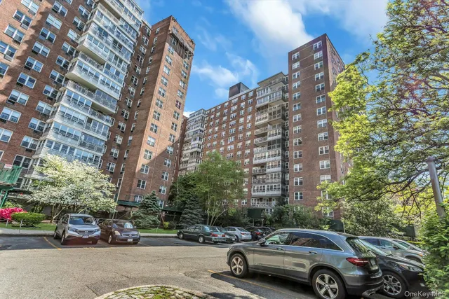a view of street with parked cars