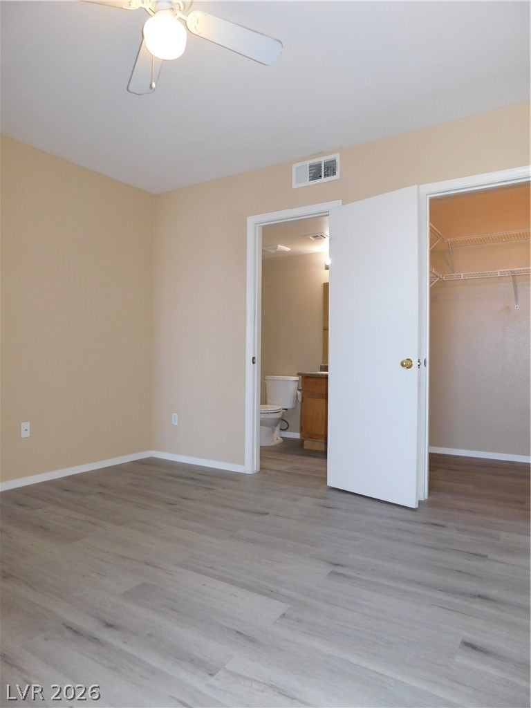 7255 West Sunset Road, Unit 2029 Las Vegas, NV 89113 - Photo 11 of 21 Contemporary interior with vaulted ceilings and light wood-look flooring offers a bright and open feel.