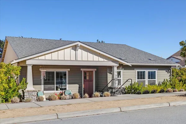 front view of a house with a yard
