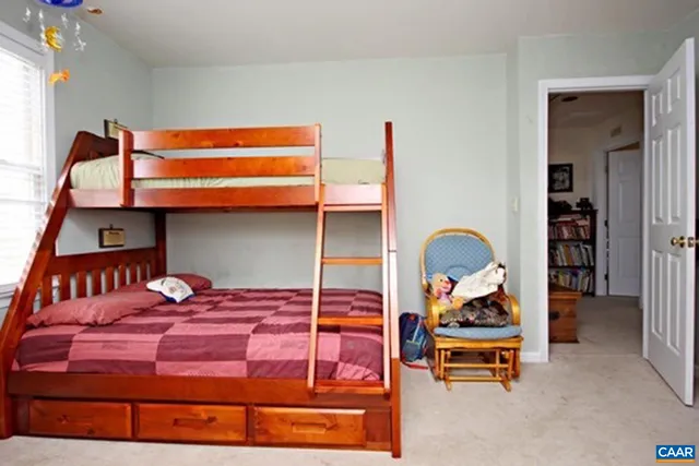 a bedroom with a bed and dresser