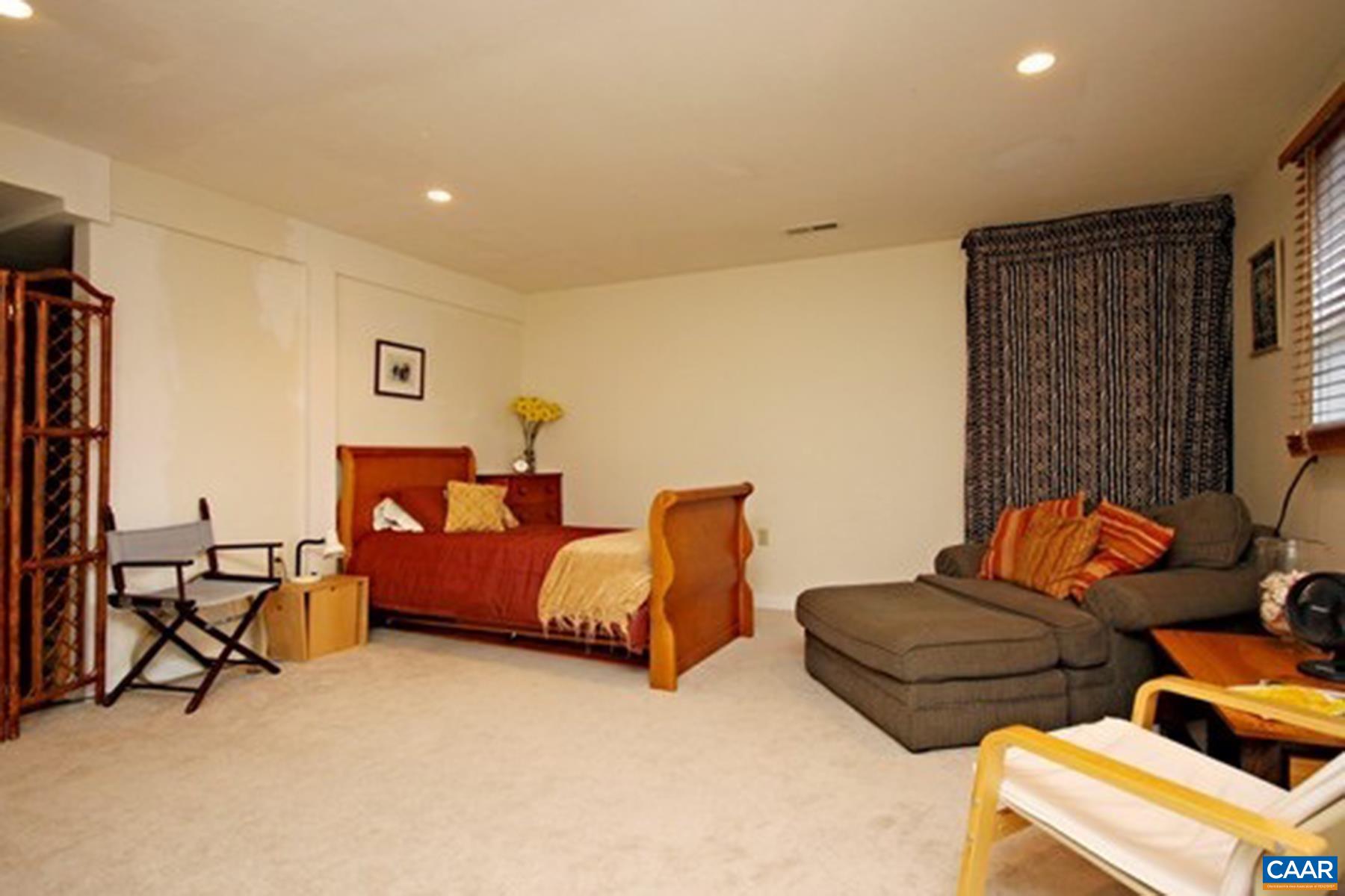 755 King Street, Unit A Charlottesville, VA 22903 - Photo 13 of 13 a living room with furniture and a flat screen tv