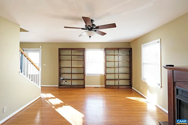 an empty room with windows and closet