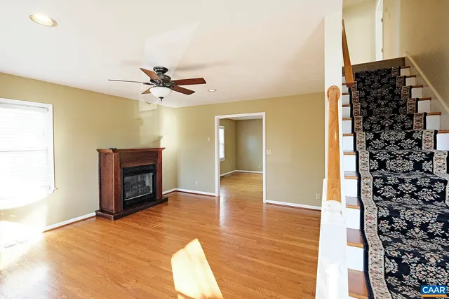 a view of livingroom with hardwood floor and a ceiling fan