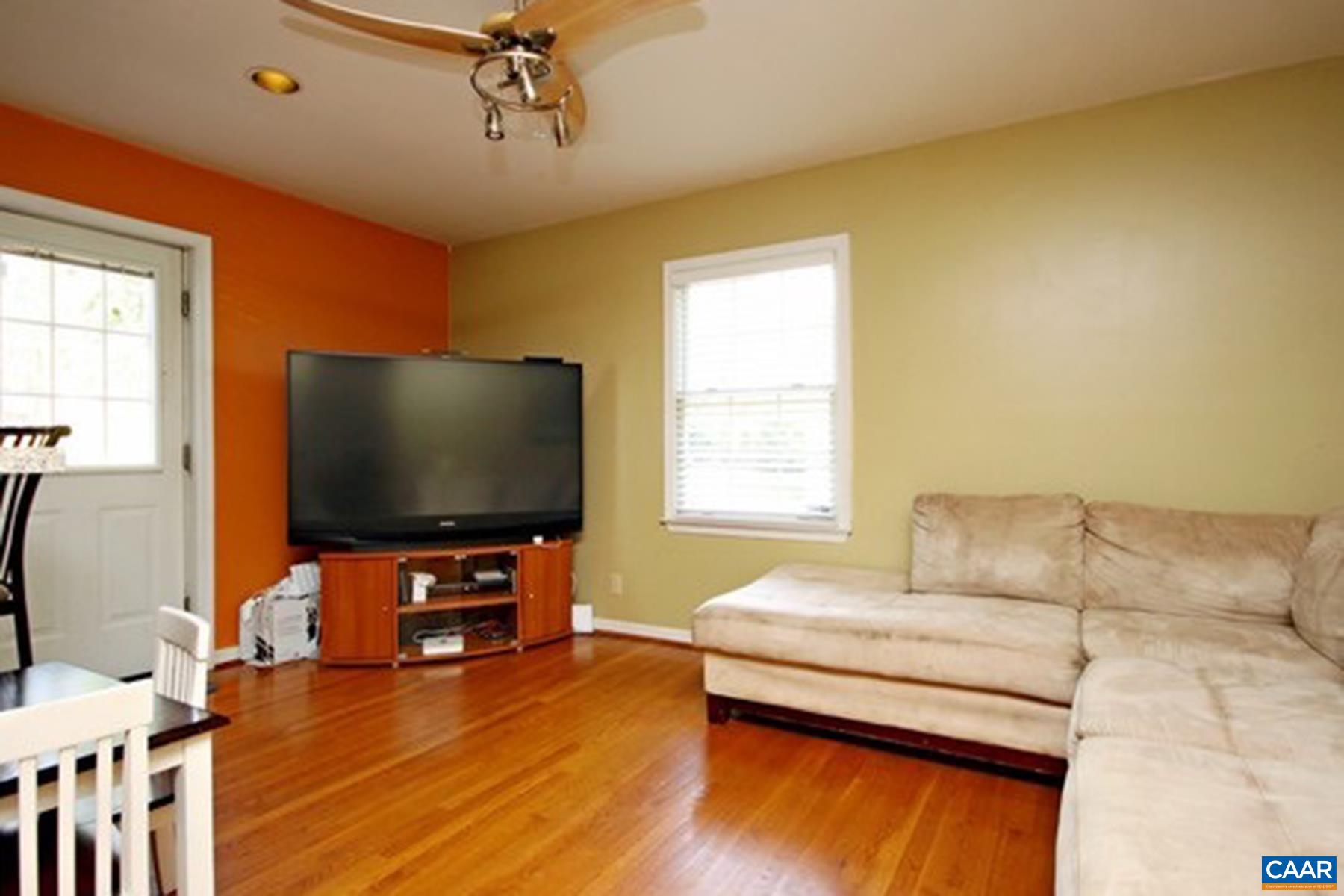 755 King Street, Unit A Charlottesville, VA 22903 - Photo 7 of 13 a living room with furniture and a flat screen tv