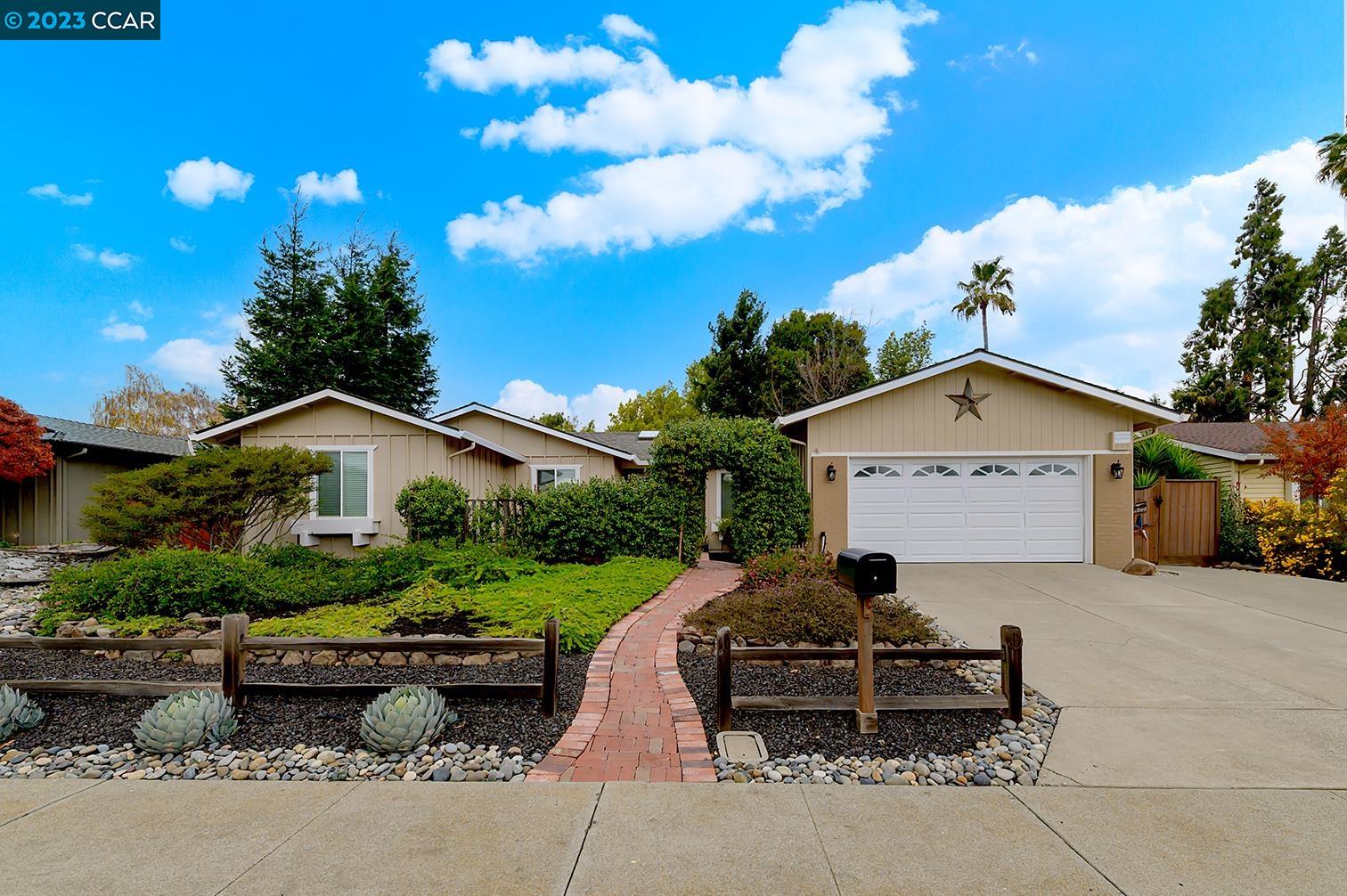 77 Carousel Place San Ramon, CA 94583 - Photo 1 of 1 a front view of a house with garden