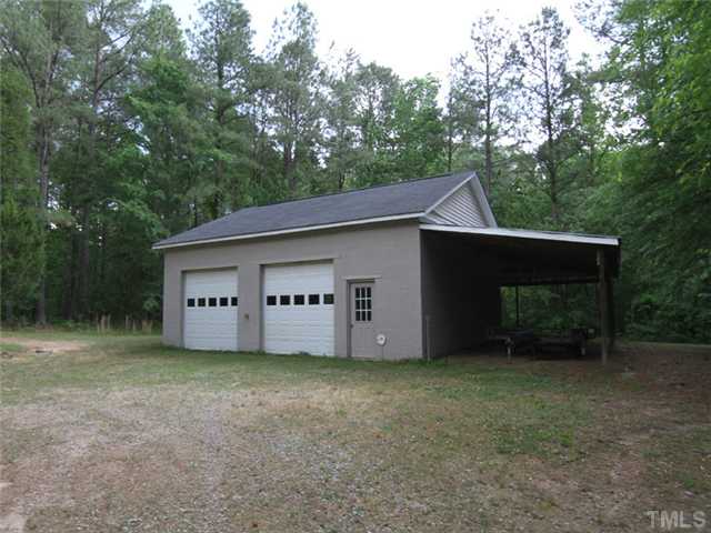 1204 Patterson Road Durham, NC 27704 - Photo 25 of 25 Detached garage that is 32x36, has 3 garage doors, lean to is 14' wide and goes across the rear of garage also...3rd Garage door is in rear!