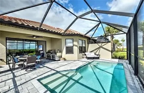 a view of a patio with a table and chairs under an umbrella
