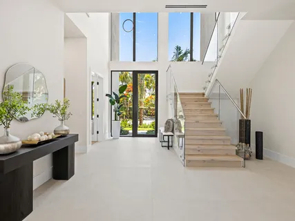 a kitchen with stainless steel appliances and white cabinets