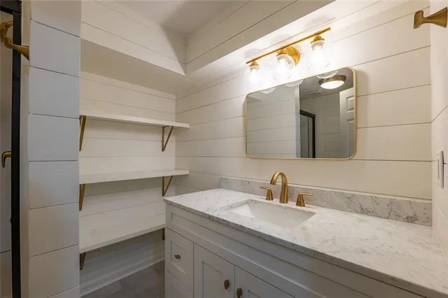 a bathroom with a sink and mirror