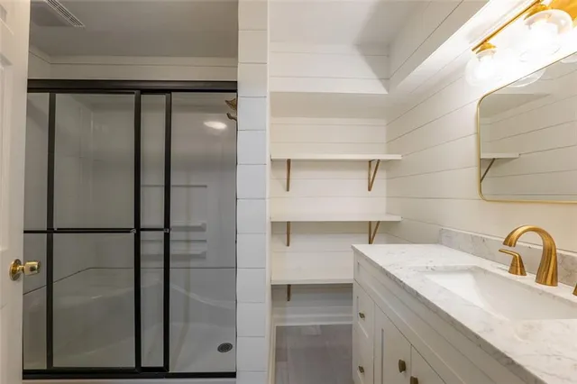 a view of a room with wooden floor