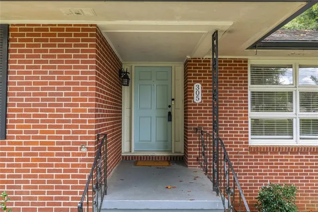 a swimming pool with big trees and a big yard