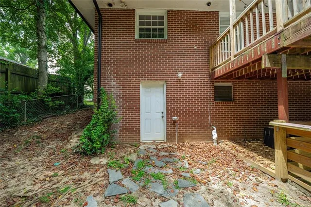 a view of balcony with wooden floor and floor to ceiling window