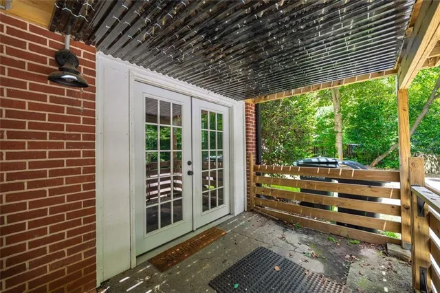 a view of balcony with wooden floor and fence