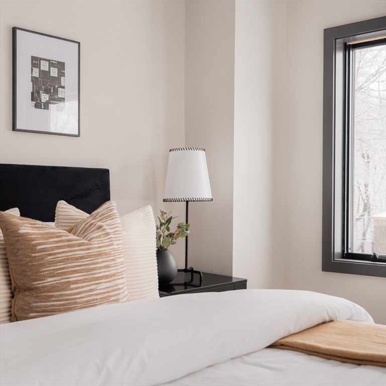 31 Highland Road, Unit 1 Brookline, MA 02445 - Photo 16 of 34 a bedroom with a bed and a window