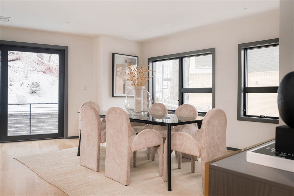 31 Highland Road, Unit 1 Brookline, MA 02445 - Photo 21 of 34 a view of a dining room with furniture and window