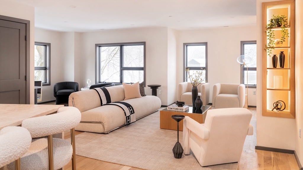 31 Highland Road, Unit 1 Brookline, MA 02445 - Photo 7 of 34 a living room with furniture and windows