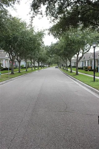 a view of a yard with swimming pool