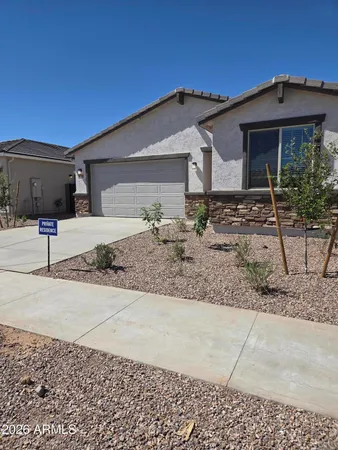 a front view of a house with garage