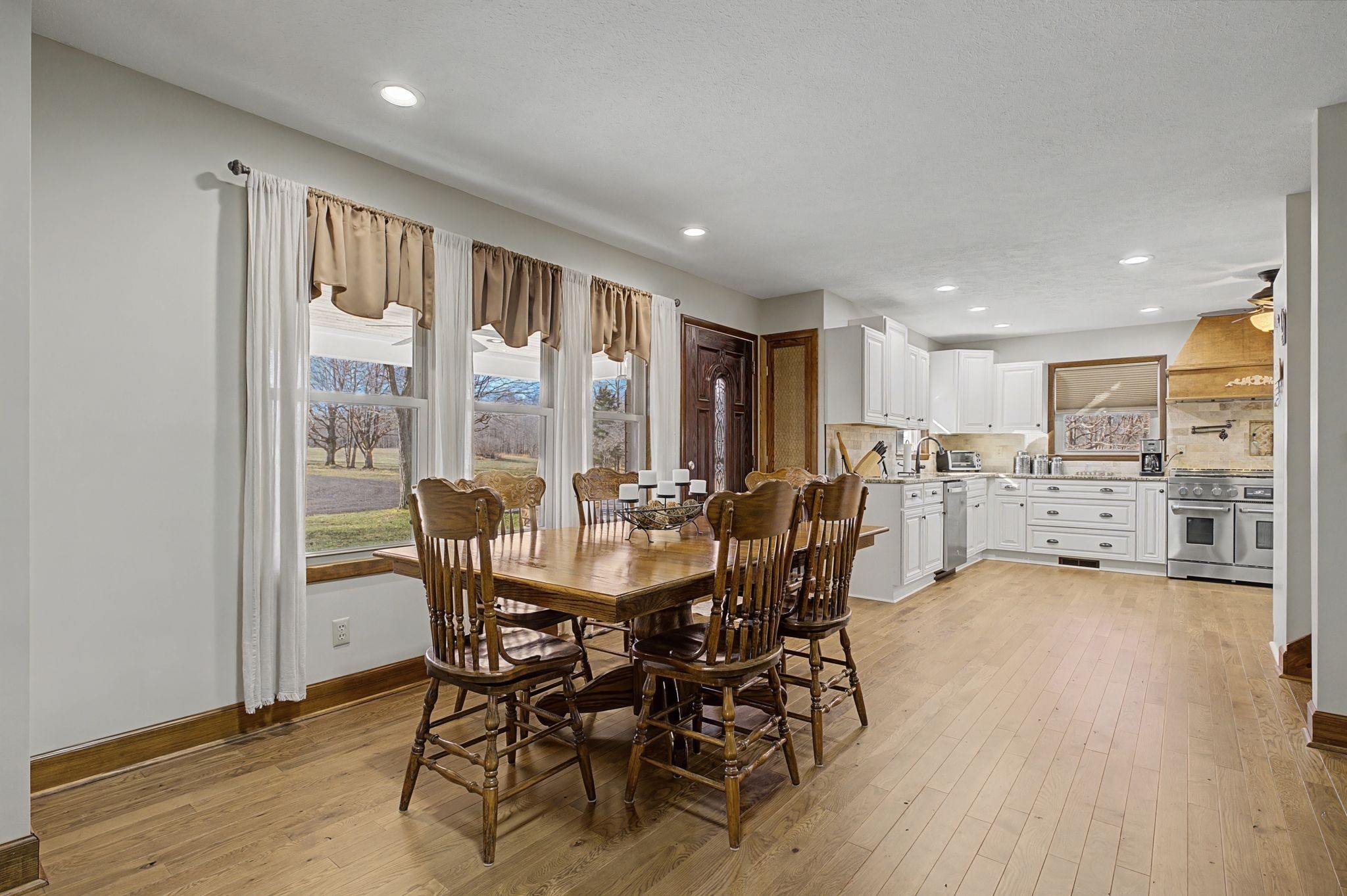 1231 Abiff Road Bon Aqua, TN 37025 - Photo 16 of 60 a view of a dining room with furniture