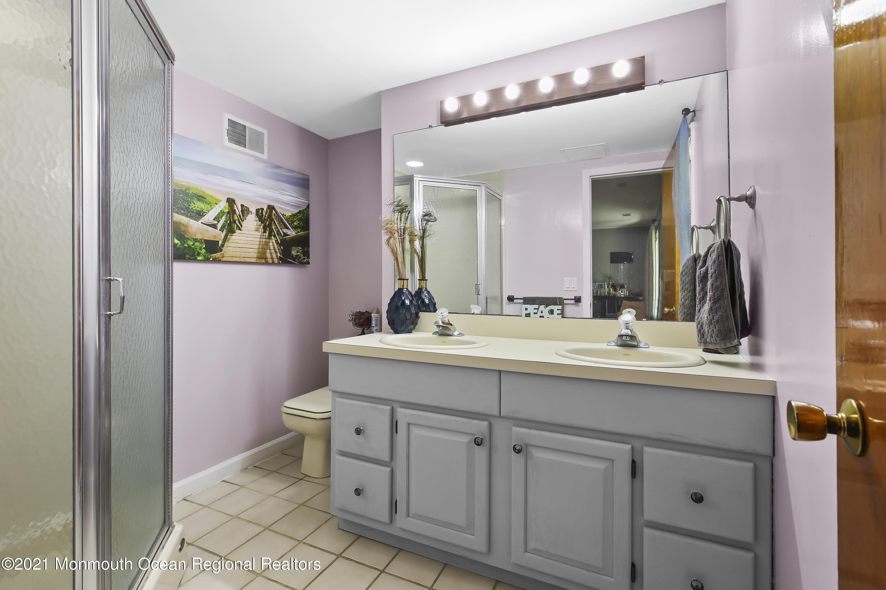 401 Cedar Swamp Road Jackson, NJ 08527 - Photo 15 of 22 a bathroom with a toilet sink and mirror