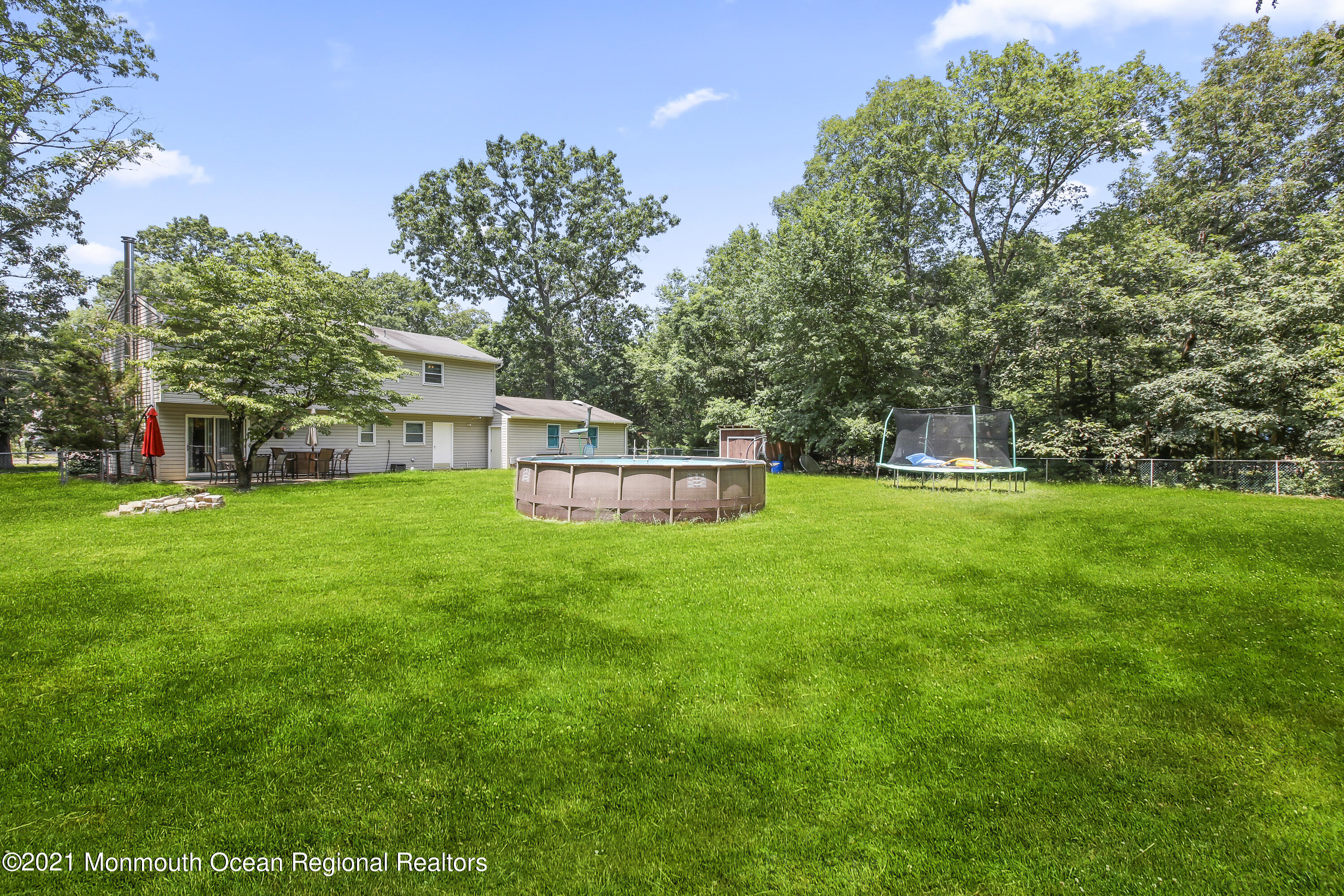 401 Cedar Swamp Road Jackson, NJ 08527 - Photo 18 of 22 a front view of a house with garden
