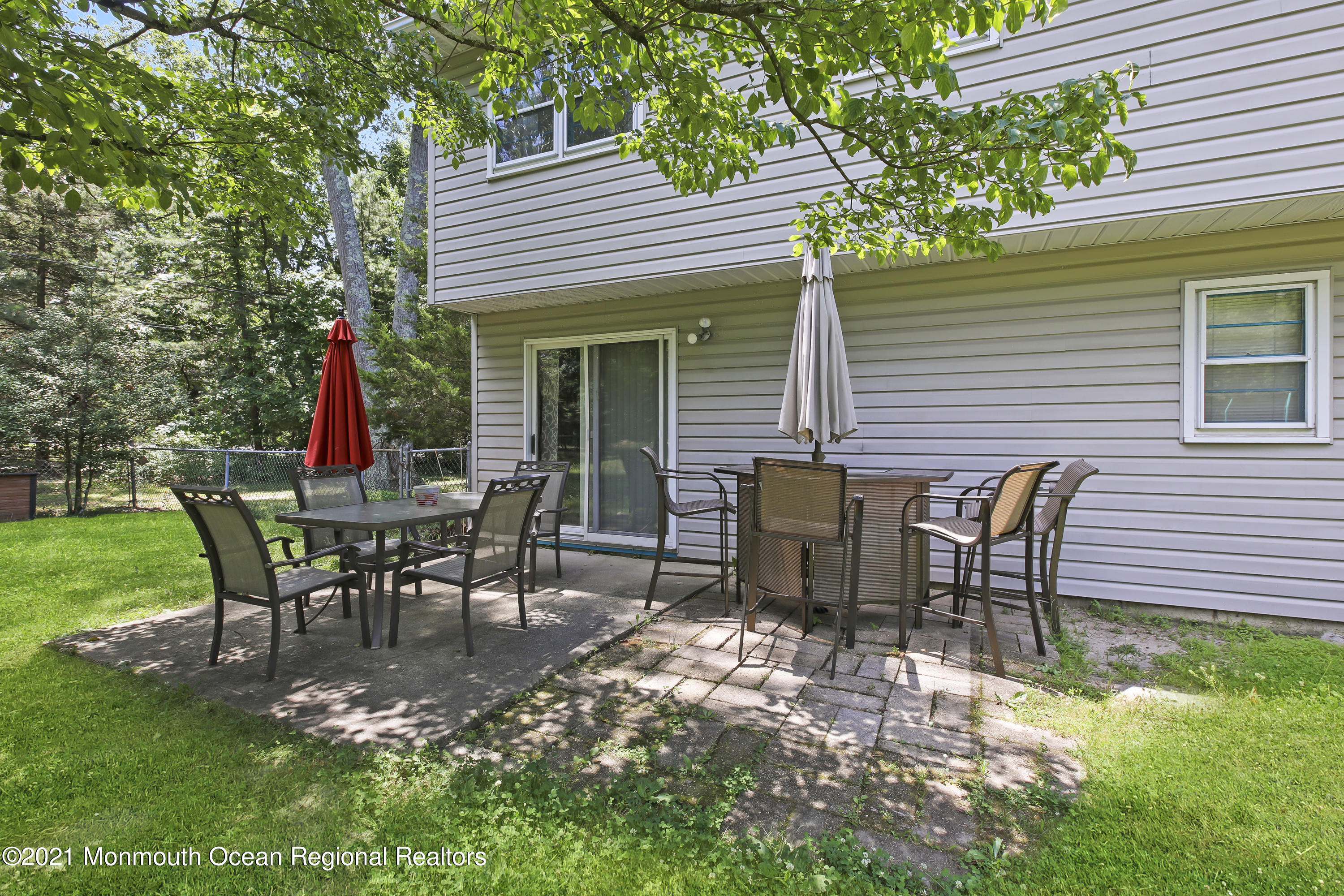 401 Cedar Swamp Road Jackson, NJ 08527 - Photo 19 of 22 a view of a table and chairs in the patio