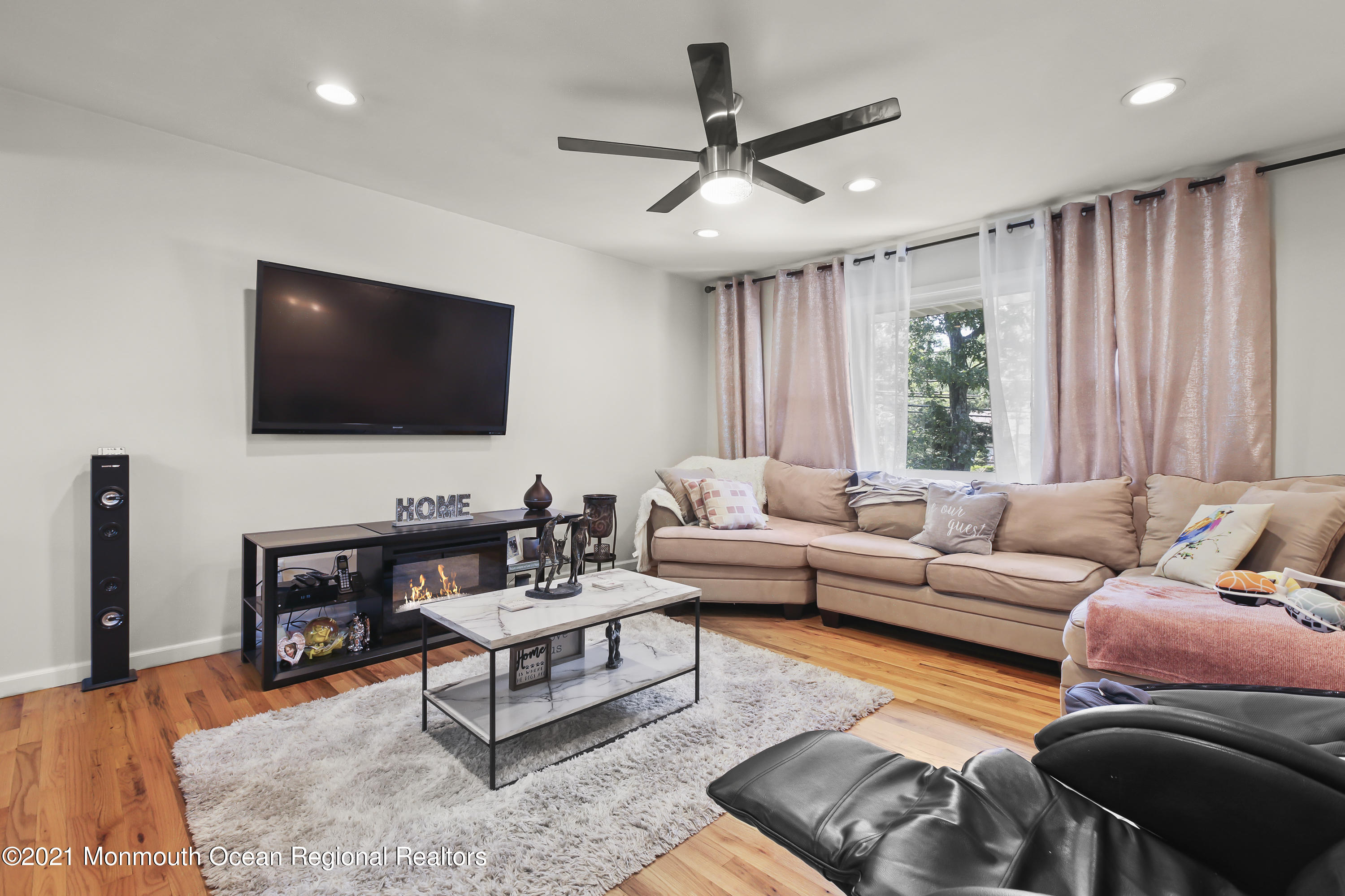 401 Cedar Swamp Road Jackson, NJ 08527 - Photo 3 of 22 a living room with furniture and a flat screen tv