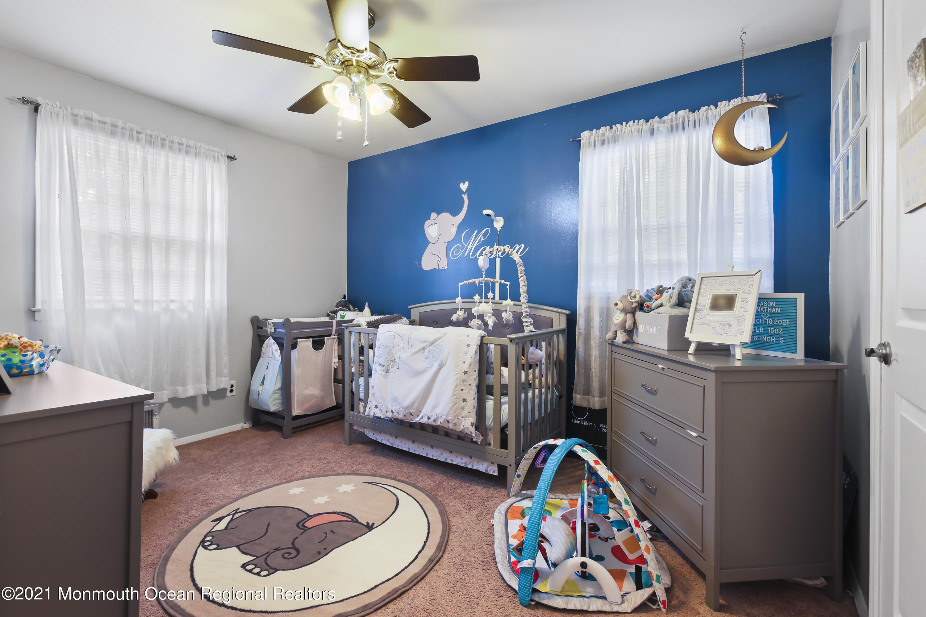 401 Cedar Swamp Road Jackson, NJ 08527 - Photo 9 of 22 a bedroom with a bed and a chandelier