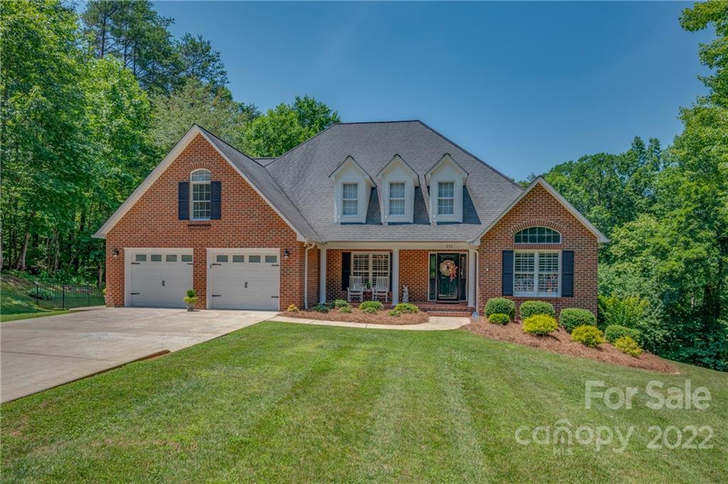 212 Ridgeview Drive Rutherfordton, NC 28139 - Photo 1 of 47 a front view of a house with a yard and trees
