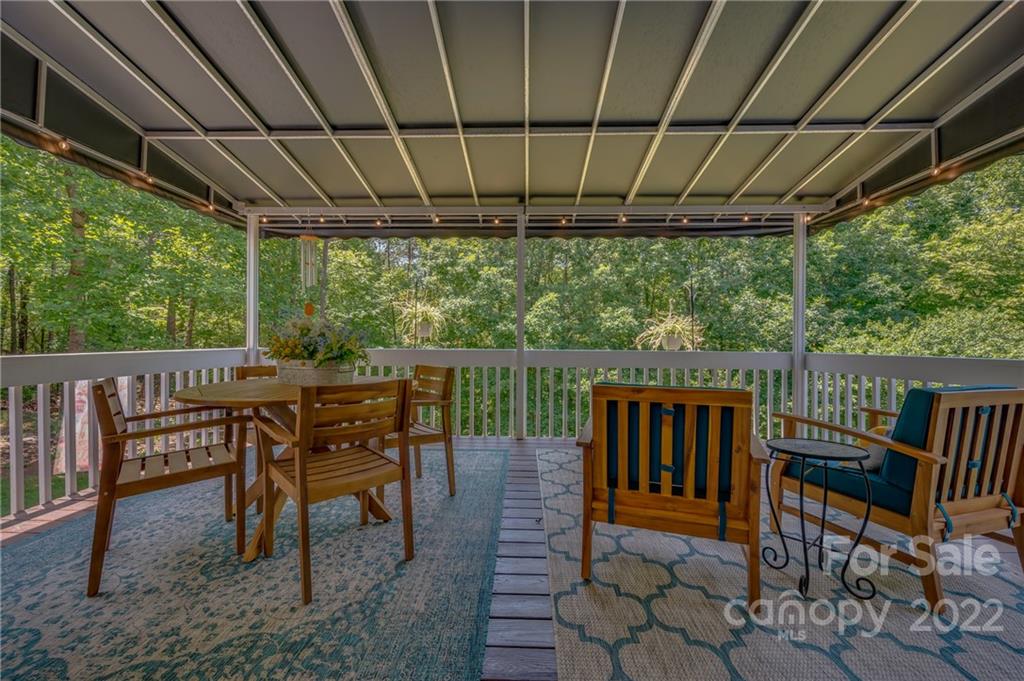 212 Ridgeview Drive Rutherfordton, NC 28139 - Photo 20 of 47 a view of a chairs and table in the patio