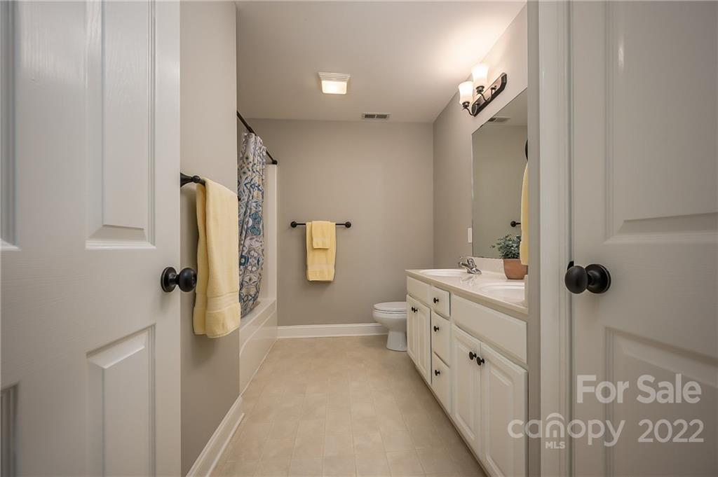 212 Ridgeview Drive Rutherfordton, NC 28139 - Photo 27 of 47 a bathroom with a double vanity sink toilet and shower