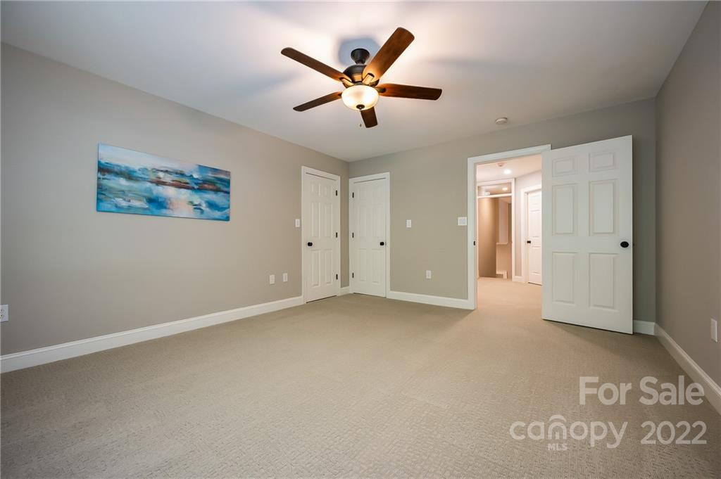 212 Ridgeview Drive Rutherfordton, NC 28139 - Photo 29 of 47 an empty room with closet and ceiling fan