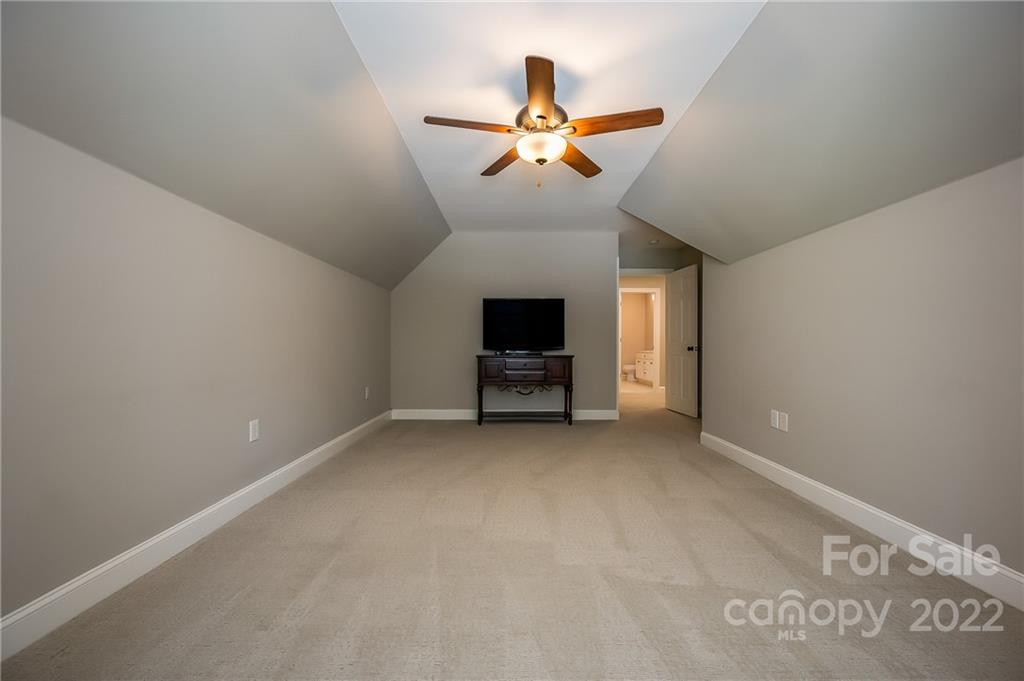 212 Ridgeview Drive Rutherfordton, NC 28139 - Photo 31 of 47 an empty room with windows and ceiling fan