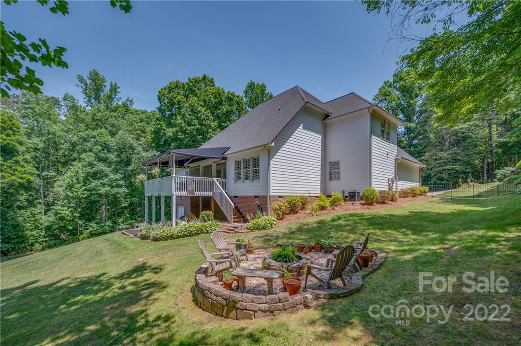 212 Ridgeview Drive Rutherfordton, NC 28139 - Photo 32 of 47 a view of a house with backyard sitting area and garden