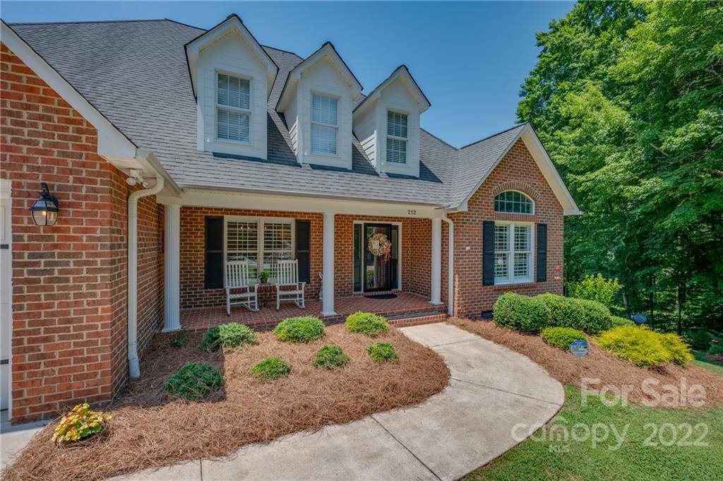 212 Ridgeview Drive Rutherfordton, NC 28139 - Photo 35 of 47 a front view of a house with garden and porch