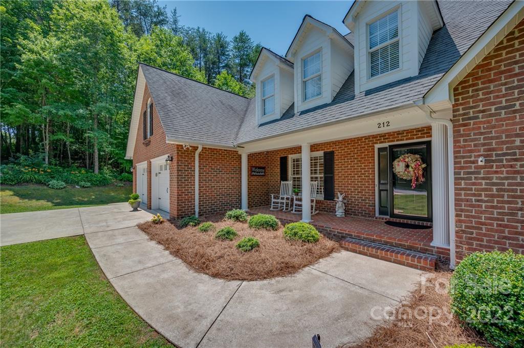 212 Ridgeview Drive Rutherfordton, NC 28139 - Photo 36 of 47 a front view of a house with garden