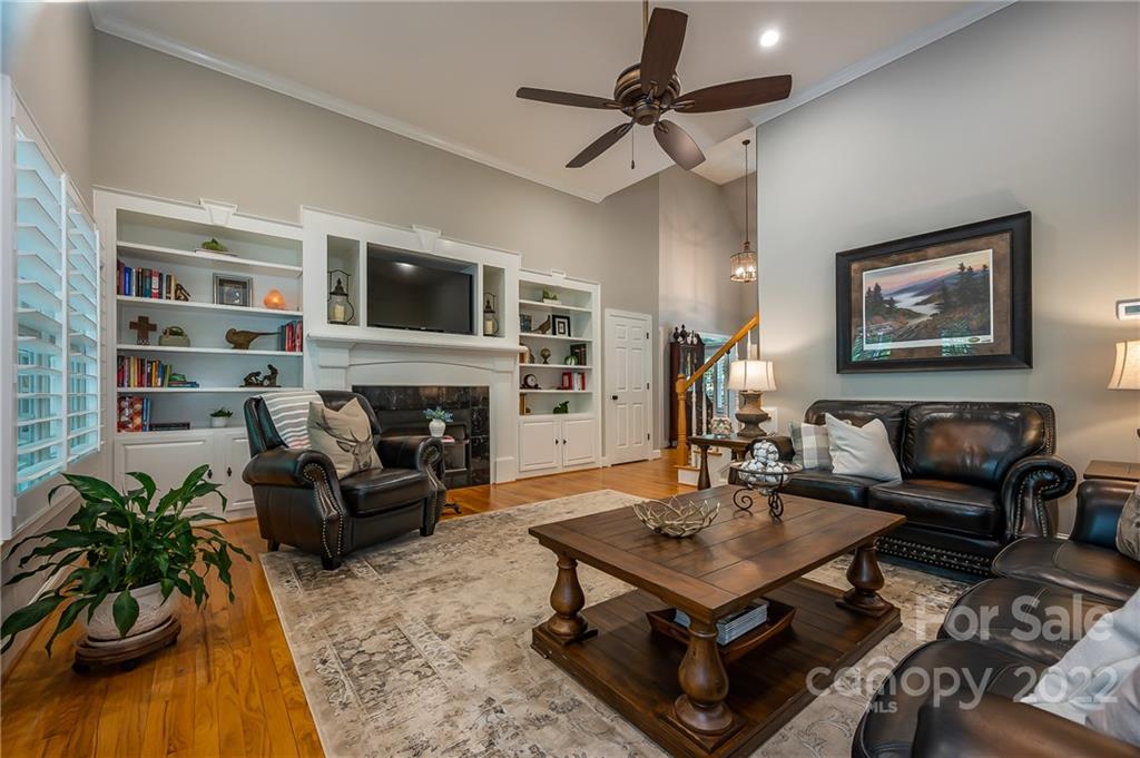 212 Ridgeview Drive Rutherfordton, NC 28139 - Photo 10 of 47 a living room with furniture a flat screen tv and a fireplace
