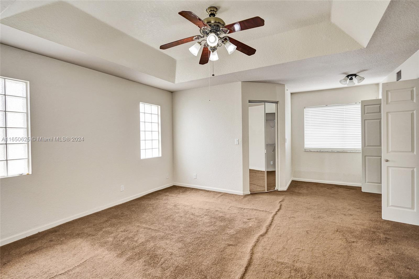 6073 Spring Isles Boulevard Lake Worth, FL 33463 - Photo 36 of 66 a view of an empty room with a window