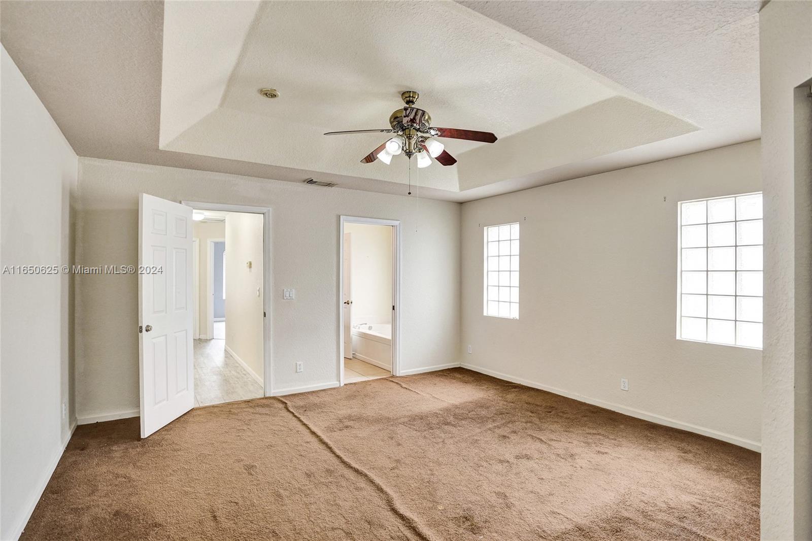 6073 Spring Isles Boulevard Lake Worth, FL 33463 - Photo 37 of 66 wooden floor in an empty room with a window
