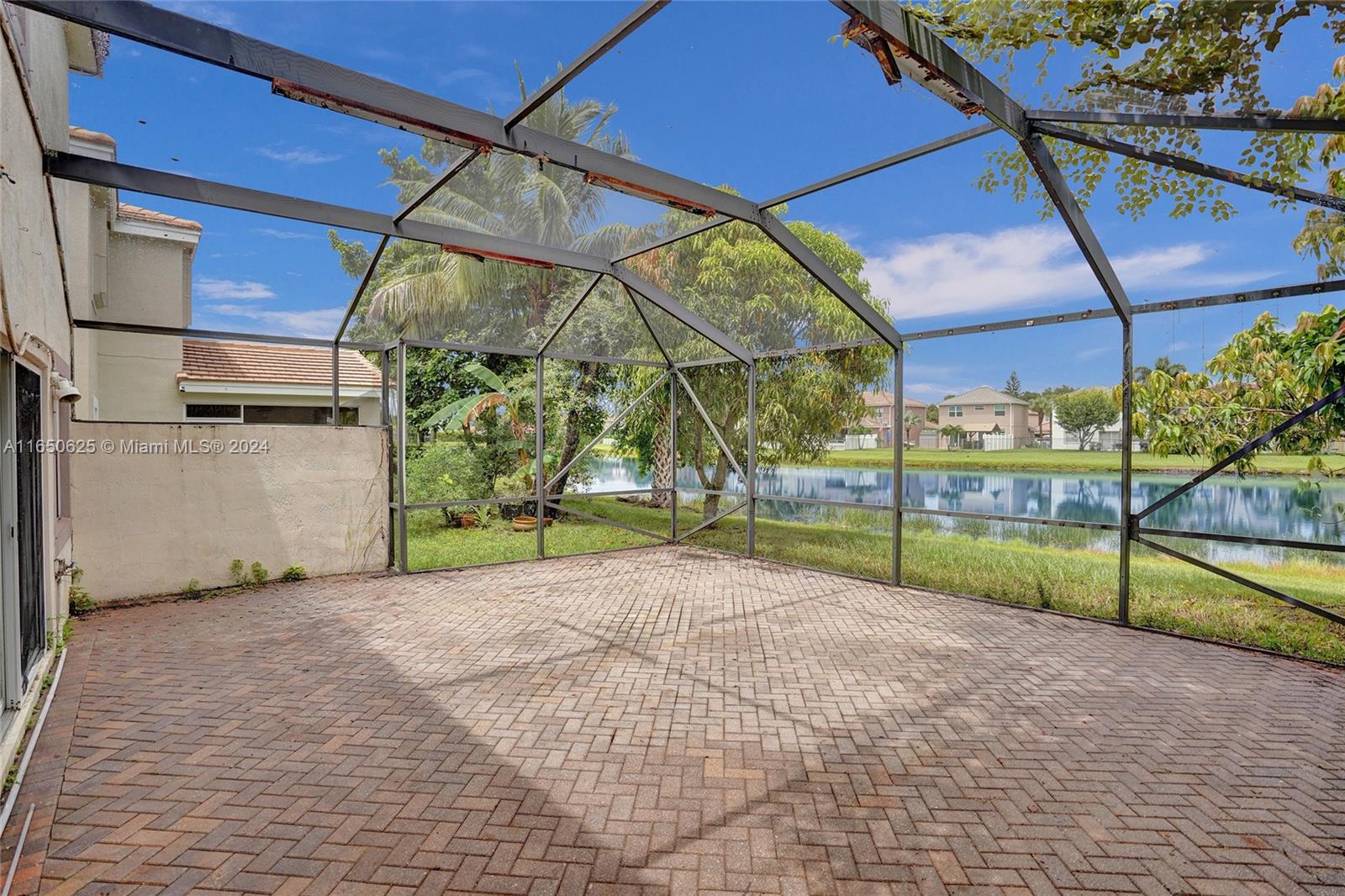 6073 Spring Isles Boulevard Lake Worth, FL 33463 - Photo 44 of 66 a view of outdoor space and porch