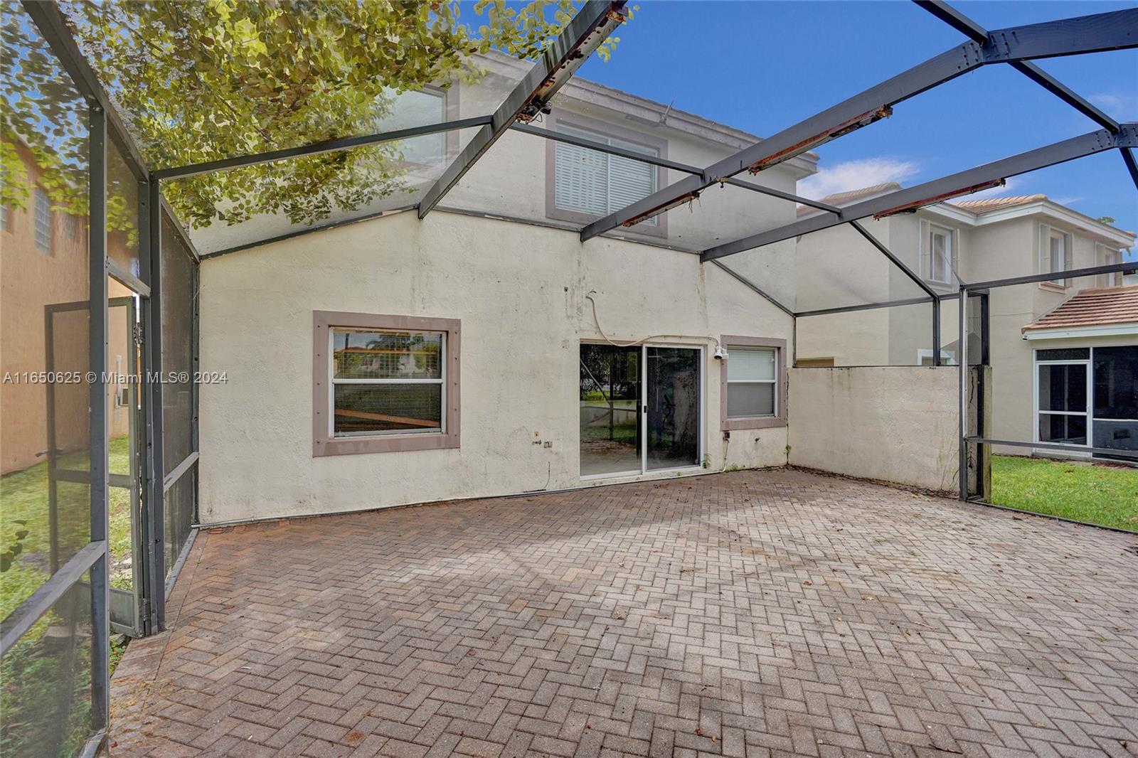 6073 Spring Isles Boulevard Lake Worth, FL 33463 - Photo 46 of 66 a view of a house with a garden