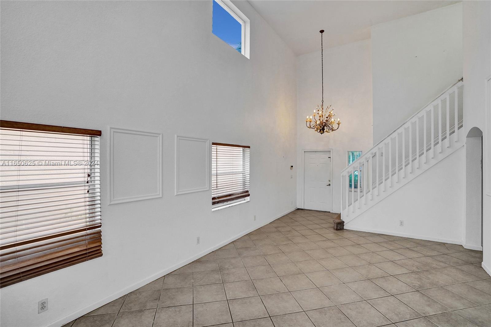 6073 Spring Isles Boulevard Lake Worth, FL 33463 - Photo 5 of 66 a view of an empty room with a window